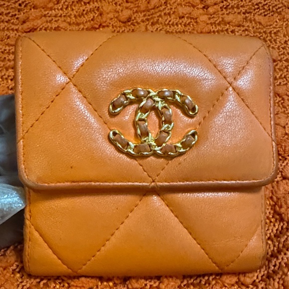 CHANEL Handbags - Chanel Gold Logo Orange Quilted Wallet